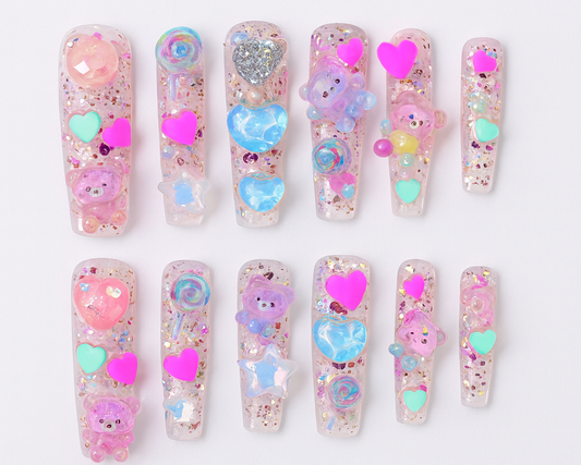 Set of decorative false nails with cartoon characters and hearts on a white background, labeled 'Kawaii Fairy'.